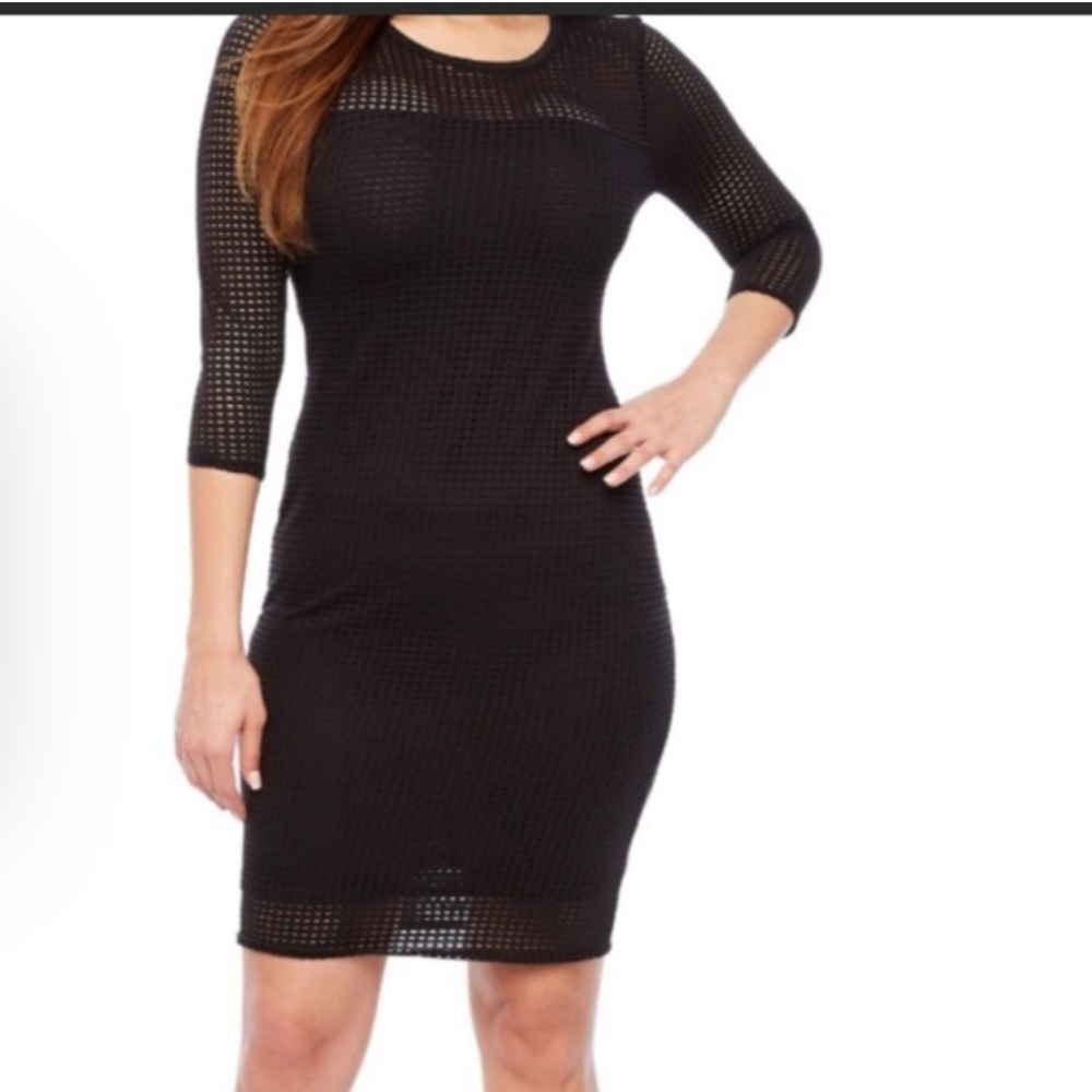 Black knee length dress.